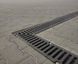 Лоток водоотводный бетонный Mega DN110 H190 с вертикальным выпуском 110 с решеткой чугунной щелевой E600